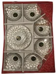 The set contains one large serving bowl and six matching smaller individual bowls, featuring a distinct textured, honeycomb-like pattern.